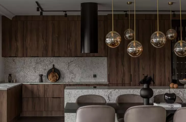 The kitchen uses wood and natural stone