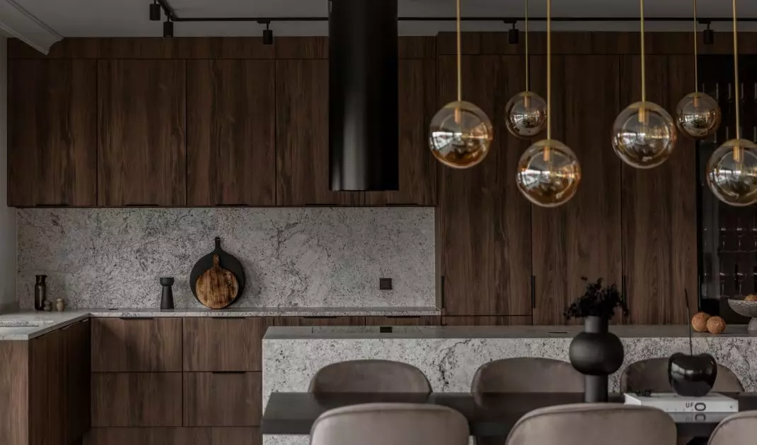 The kitchen uses wood and natural stone