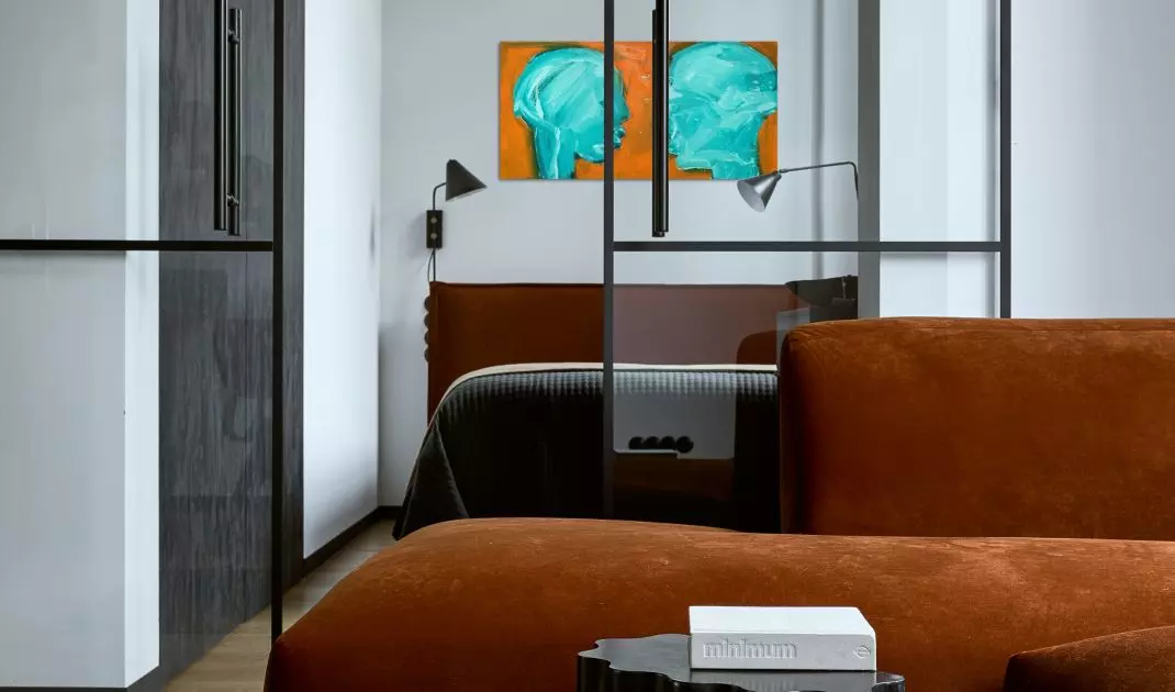 The industrial color scheme is broken by brick-red