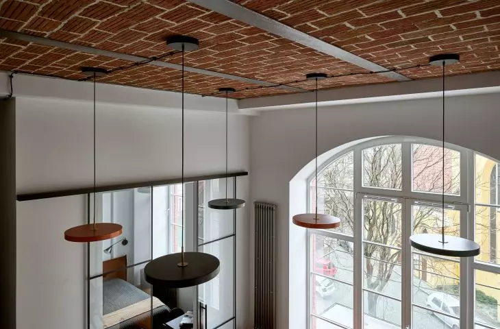 The ceiling features original historic bricks
