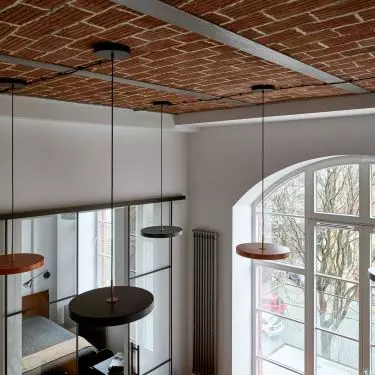 The ceiling features original historic bricks