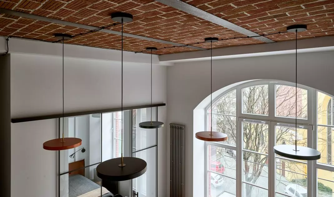 The ceiling features original historic bricks
