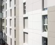 Hardie Panel application example, facade renovation in a multi-family building, Reggio Emilia, Italy