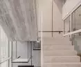 one of the key architectural elements of the building is the glass staircase