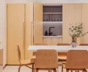 The kitchenette is hidden behind sliding fronts