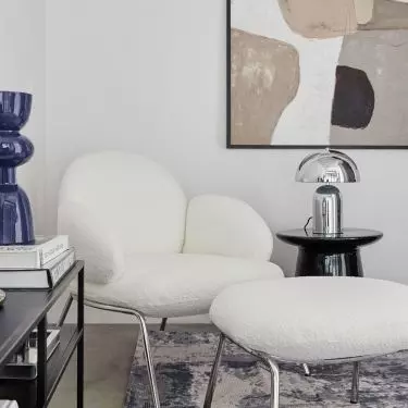 Warm textiles juxtapose with raw materials such as metal