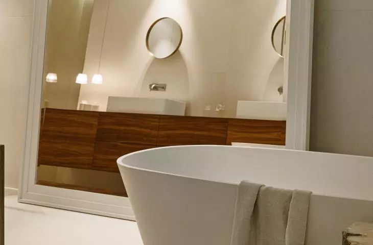 A large mirror optically enlarges the space