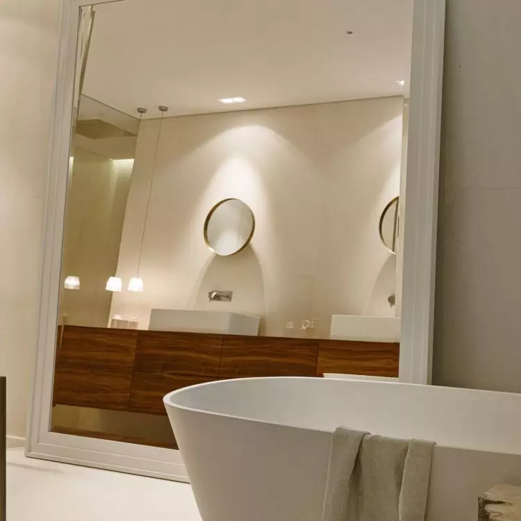 A large mirror optically enlarges the space