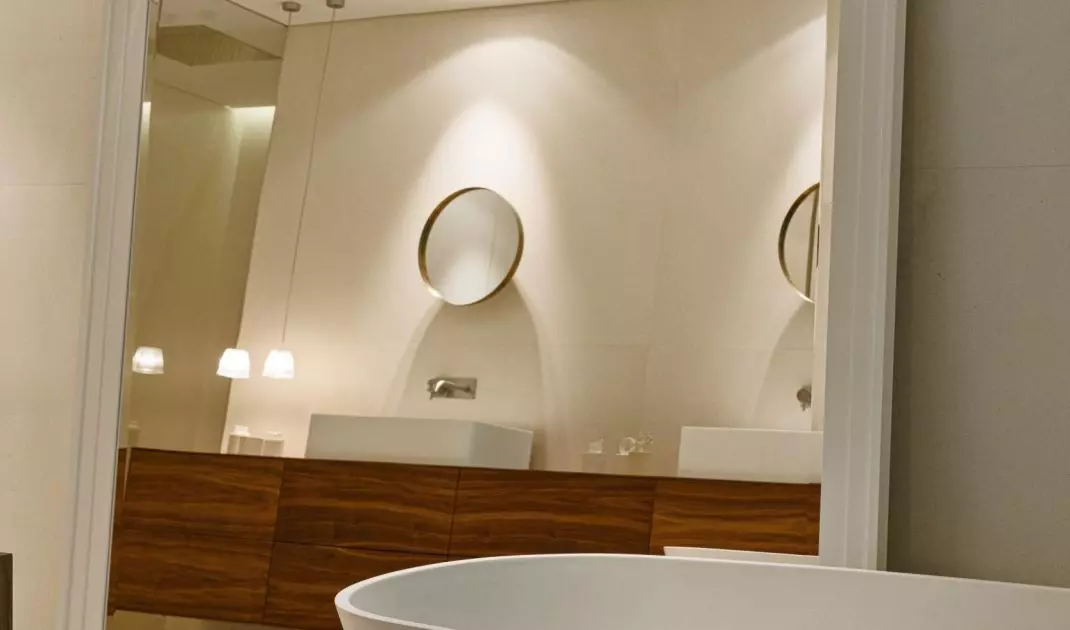A large mirror optically enlarges the space