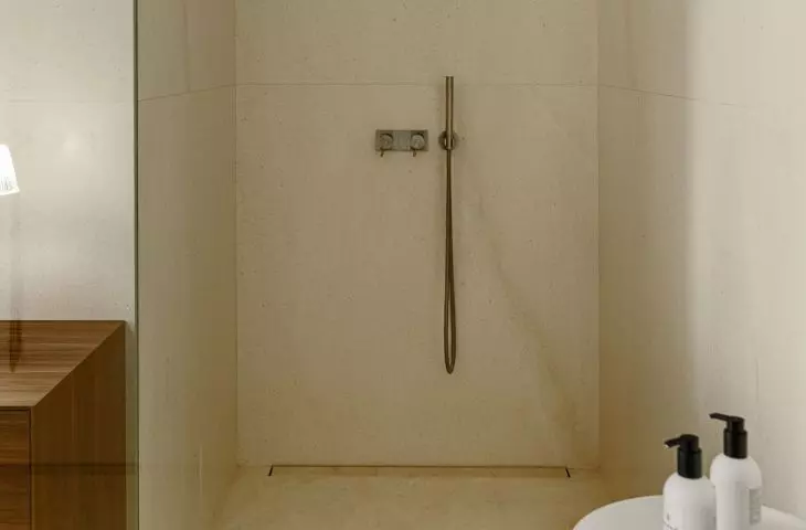 The minimalist shower was separated only by a glass wall