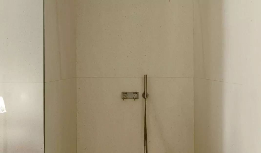 The minimalist shower was separated only by a glass wall