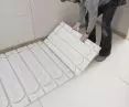 Laying fermacell® Therm 25™ underfloor heating elements