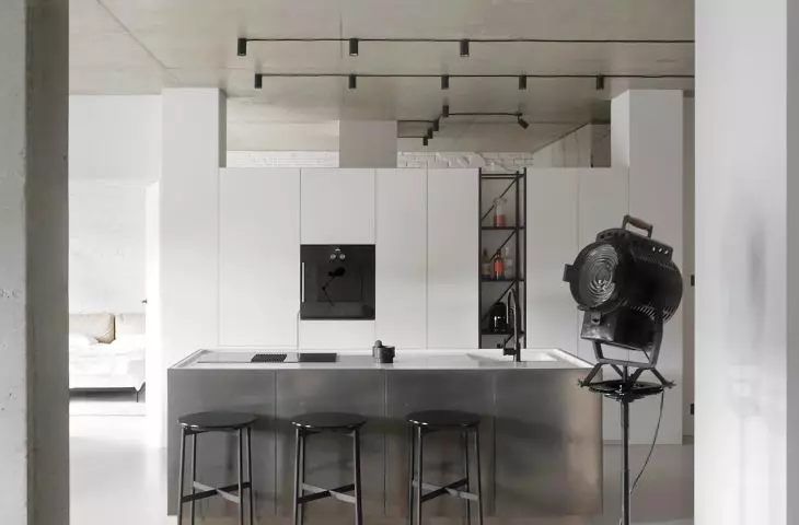 The fronts of the kitchen island were covered with liquid metal