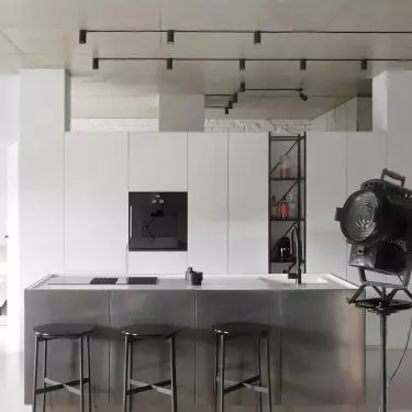 The fronts of the kitchen island were covered with liquid metal