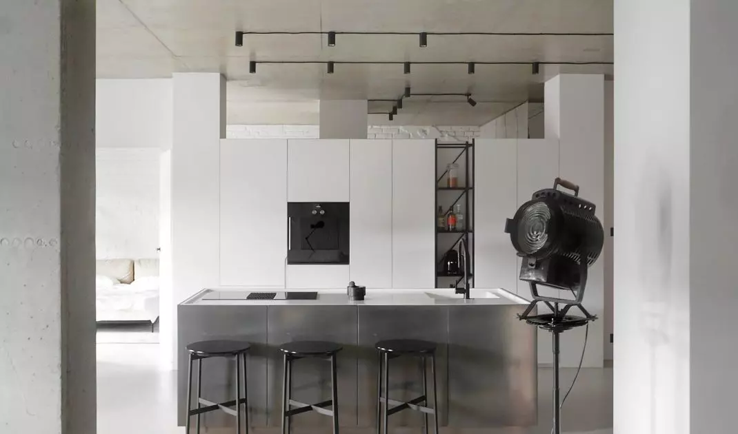 The fronts of the kitchen island were covered with liquid metal