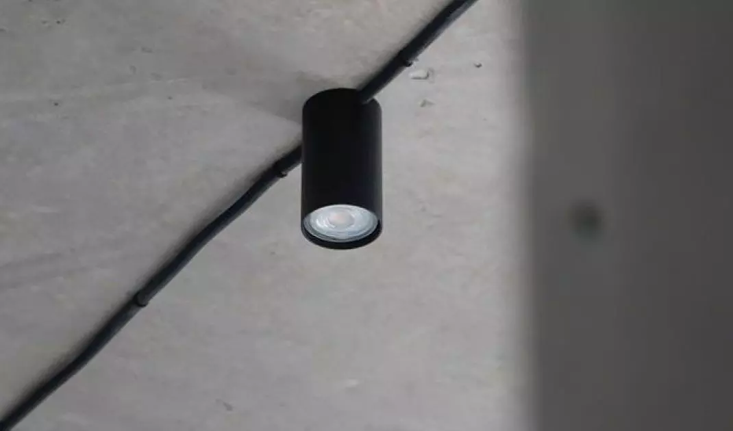 Black light fixtures emphasize the somewhat industrial character of the interior