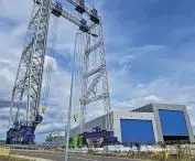 a monstrous gantry crane on Gryfia Island: the tallest in Poland and one of the tallest in the world, it can lift and move objects weighing up to 1400 tons to a height of 100 meters