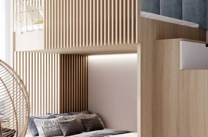 The bunk bed has been finished with piping, mesh and upholstered panels