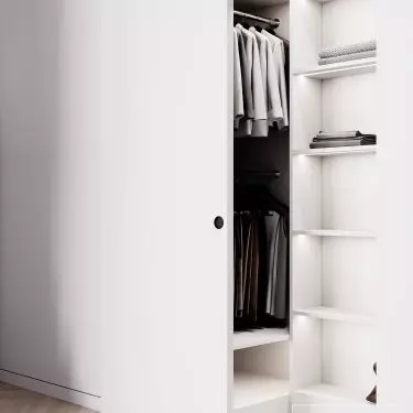 The closet is equipped with solutions for easy storage of clothes