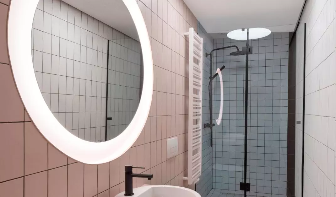 A walk-in shower was placed in the elongated room