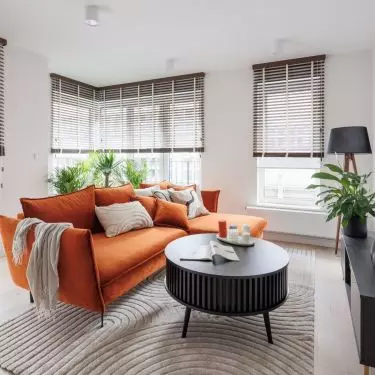 The fluted table will be an interesting part of the living room design