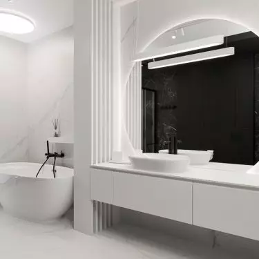 In the white part of the bathroom there is a bathtub