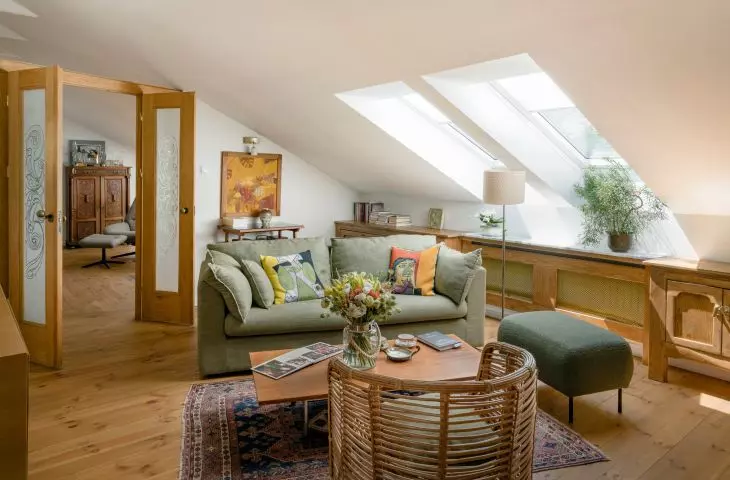 The focal point of the living room is the olive sofa