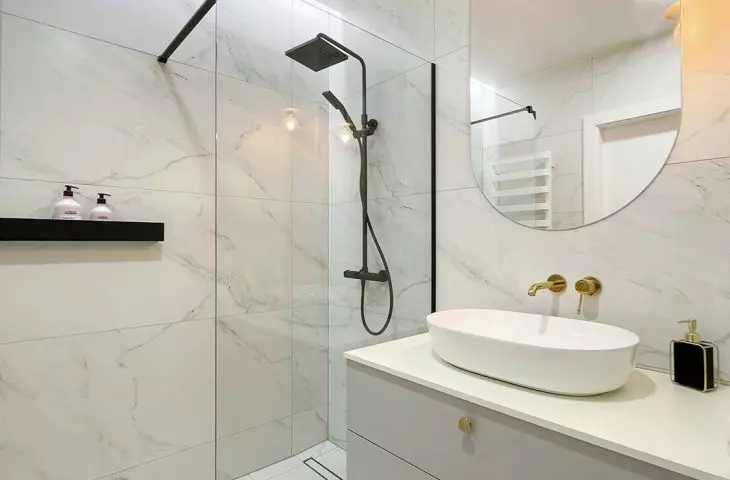 The walk-in shower has a minimalist form