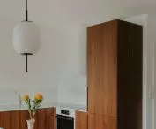 Kitchen cabinetry, and an antique glass vase on the table