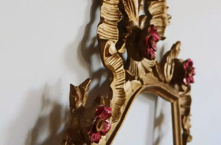 A mirror with a decorative frame is a great addition to a Coquette-style interior
