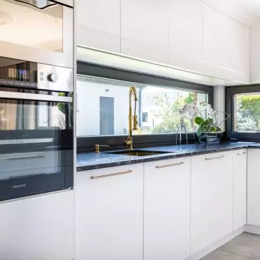 Kitchen cabinets have white fronts
