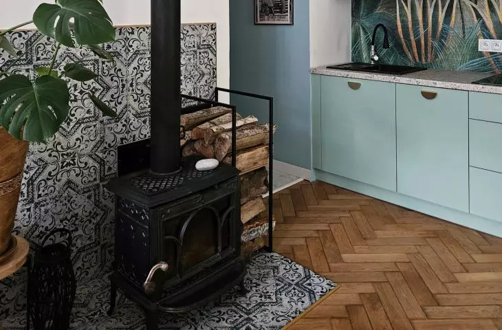 The goat-type fireplace stood against a background of ornate tiles