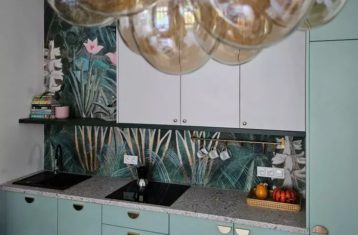 The mint-colored housing has been fitted with gold handles