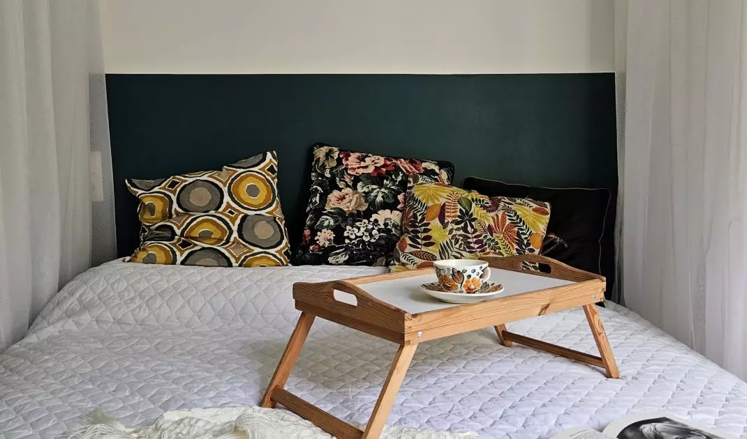 Bedroom arrangement combines subdued base with vibrant accents