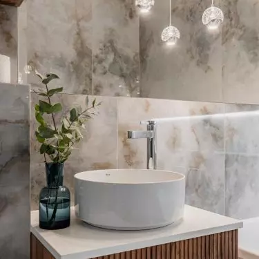 Above the sink hang decorative lights