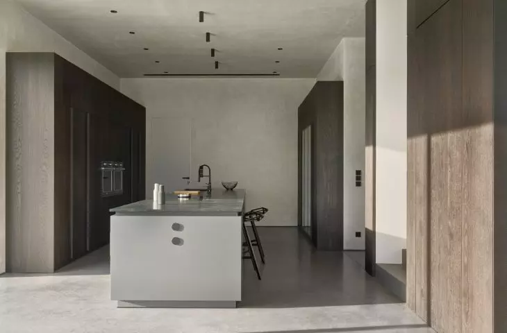 Wide island allows for comfortable use of the kitchen