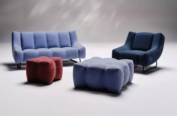 The collection consists of an armchair, two sizes of sofa and pouffe and two coffee tables