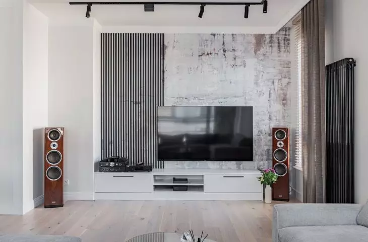 The TV wall was decorated with wallpaper