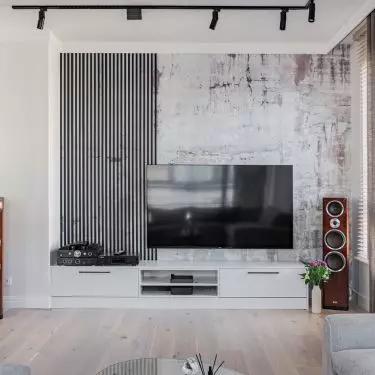 The TV wall was decorated with wallpaper