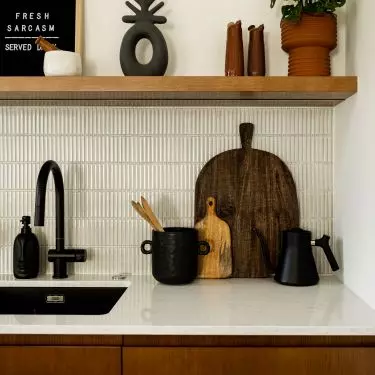 The kitchen is kept in earthy colors