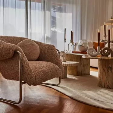 Juxtapose different textures, for example, soft fabrics with raw wood