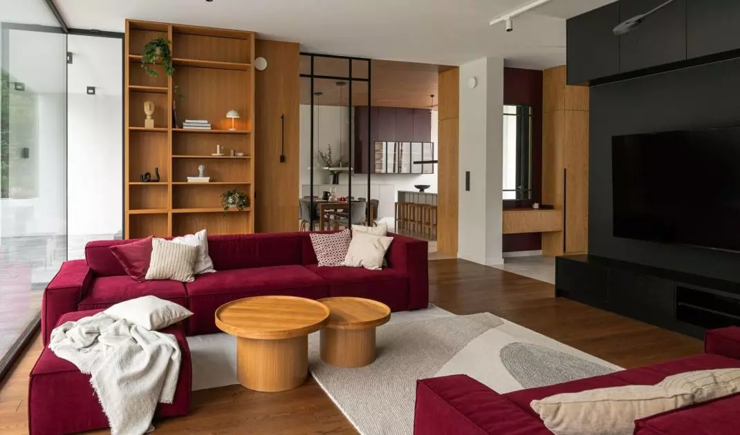 The focal point of the living room is two modular sofas in a strong color