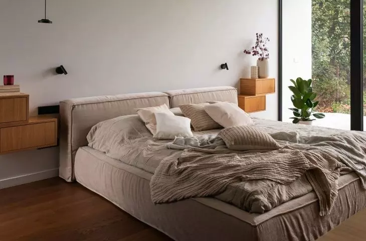 In the lighter part stands a bed