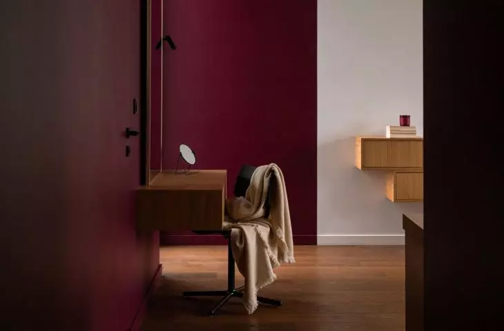 Toilet was placed against a colorful wall
