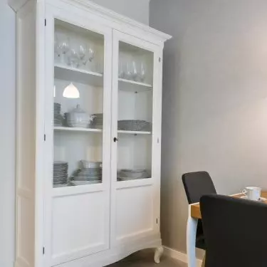 The kitchen is decorated with an English-style sideboard