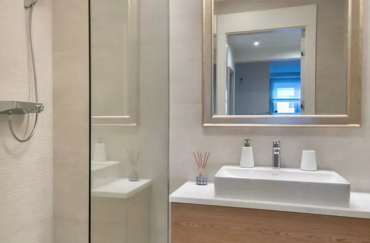 In the bathroom you will find a mirror in an ornate frame