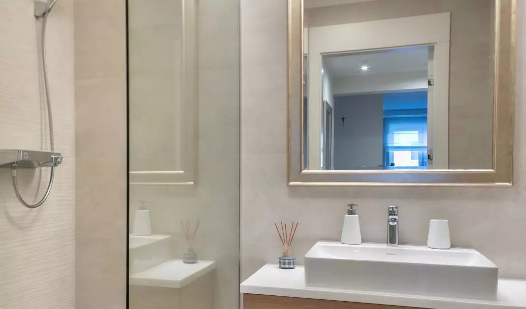 In the bathroom you will find a mirror in an ornate frame