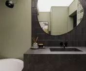 The tiles in the bathroom relate to the clinker on the building's facade