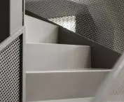 Detail of staircase with metal mesh