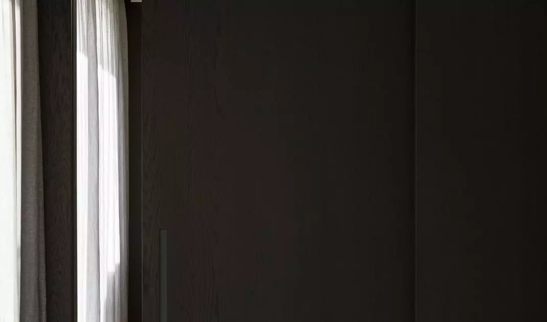 The study was separated from the living room by a movable wall